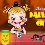 Bé gái đang chơi cùng sản phẩm thủ công Halloween với một con nhện đồ chơi trên bàn và nền chữ Halloween Craft