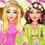 Hai cô gái hoạt hình xinh đẹp cười rạng rỡ, một người tóc vàng đội mũ và mặc váy hồng, người kia tóc nâu đeo băng đô hoa, mặc áo xanh trước nền hoa anh đào