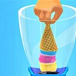 Một bàn tay đang đặt cây kem ốc quế nhiều tầng vào trong máy xay sinh tố