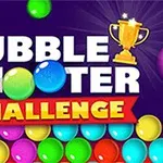 Hình ảnh có chữ BUBBLE SHOOTER CHALLENGE với cúp vàng và các quả bóng màu sắc trên nền tím