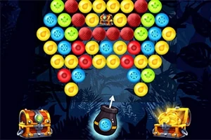 Hình ảnh hiển thị các quả bóng màu sắc xếp chồng và một khẩu súng bắn bóng ở phía dưới, với hai rương kho báu ở hai bên