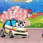 Hai chiếc xe hoạt hình với mắt to, một chiếc xe cảnh sát màu trắng và một chiếc xe màu hồng có quạt, đang ở trên con đường trước phong cảnh núi non và hoa anh đào