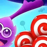 Nhân vật hoạt hình màu tím tươi cười bên cạnh những viên kẹo xoắn đỏ trắng trên phông nền xanh da trời