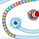Nhân vật mặc đồ ông già Noel bắn các viên bi màu vào hàng bi đang di chuyển trên nền tuyết trắng