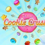 Chữ Cookie Crush 2 màu hồng và trắng nổi bật trên nền bánh donut hồng và nhiều loại bánh kẹo đầy màu sắc xung quanh