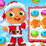 Nhân vật mặc trang phục ông già Noel đứng cạnh bảng ô vuông chứa bánh vòng màu sắc và hình ngôi sao