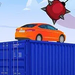 Chiếc xe màu cam đậu trên thùng container màu xanh, phía trên là quả cầu gai lớn màu đỏ lơ lửng