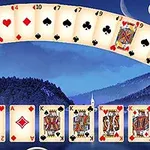 Bộ bài tây trải ra trên nền phong cảnh núi non xanh thẳm