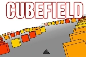 Các khối lập phương màu vàng và cam nằm trên một con đường rộng màu xám với từ CUBEFIELD phía trên
