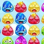 Các con quái vật nhỏ với nhiều màu sắc và biểu cảm khác nhau hiển thị trong một lưới trên nền xanh