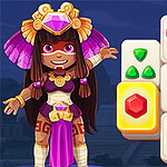 Nhân vật hoạt hình mặc trang phục Aztec đứng cạnh các ô vuông có hình biểu tượng màu sắc