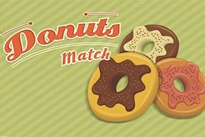Ba chiếc bánh donut với các lớp phủ sô-cô-la khác nhau nằm trên nền kẻ sọc xanh
