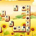 Các mảnh ghép gạch xếp chồng lên nhau trong một cảnh nền hoa hướng dương và cây cối vào buổi hoàng hôn