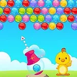 Hình ảnh có một chú chim nhỏ màu vàng đứng cạnh một bộ bắn bóng, với nhiều quả bóng màu sắc khác nhau ở trên nền bầu trời xanh