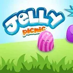 Ba viên kẹo thạch có mặt cười vui nhộn với dòng chữ Jelly Picnic và biểu tượng cúp +500 trên nền cỏ xanh