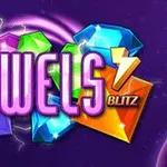 Các viên đá quý nhiều màu sắc như đỏ, xanh, và tím với dòng chữ Jewels Blitz nổi bật trên nền tím