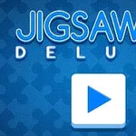Nền màu xanh với chữ Jigsaw Deluxe và biểu tượng mảnh ghép, kèm nút phát hình tam giác trắng