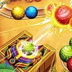 Một loạt các quả cầu đầy màu sắc đang di chuyển trên một đường ray, với một thiết bị phóng quả cầu nằm ở góc dưới bên trái
