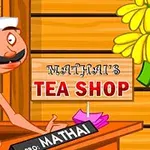 Người đàn ông với ria mép đứng sau quầy với biển hiệu ghi Mathais Tea Shop trên nền gỗ, và có một chùm chuối treo bên cạnh