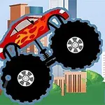Xe tải quái vật màu đỏ với lửa trên thân xe, bánh xe lớn, phông nền là thành phố với các tòa nhà chọc trời