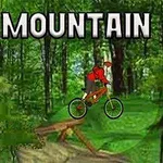 Một người đang đi xe đạp leo núi qua địa hình rừng với chiếc xe đạp và chữ MOUNTAIN BIKE ở góc trên