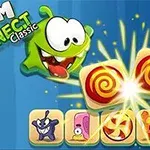 Nhân vật hoạt hình màu xanh với đôi mắt to và miệng mở to cạnh các viên kẹo xoáy đỏ trắng lấp lánh
