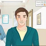 Một y tá đứng cạnh một người đàn ông trẻ tuổi trong hành lang bệnh viện với các biển chỉ dẫn phòng