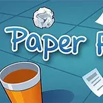 Hình ảnh có chữ Paper Flick, một cốc đựng đồ uống, quạt nhỏ và tờ giấy bay trên bàn màu xanh