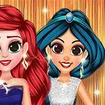 Hai nhân vật hoạt hình với mái tóc đỏ và xanh, mặc váy dạ hội lấp lánh, đứng trước phông nền vàng