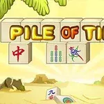 Hình ảnh có các viên gạch với chữ “PILE OF TILES” nổi bật và một cảnh nền bãi biển với cây cọ và đá