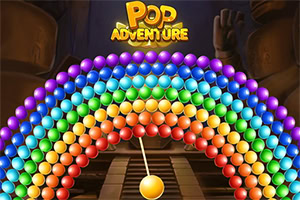 Logo Pop Adventure phía trên vòm bóng nhiều màu, bên dưới là quả bóng vàng treo trước lối đi trong hang tối