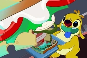 Một nhân vật hoạt hình màu vàng đang chế biến một chiếc bánh sandwich lớn với nhiều lớp nhân và rau tươi