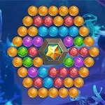 Các quả bóng màu sắc được sắp xếp trong hình tròn xung quanh một viên đá quý nằm ở trung tâm, trên nền đại dương xanh biếc