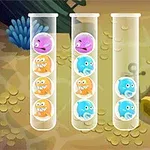 Các ống nghiệm chứa những quả bóng với khuôn mặt biểu cảm khác nhau và màu sắc khác nhau đặt trên nền đáy biển