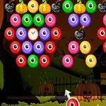 Các quả bóng nhiều màu sắc, bí ngô và mặt nạ ma quái trên nền cảnh đêm Halloween