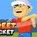 Cậu bé đội mũ trắng đánh bóng cricket cạnh dòng chữ Street Cricket