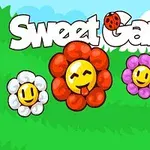 Chữ Sweet Garden nổi bật với hình ảnh bông hoa mặt cười nhiều màu sắc và một con bọ rùa ở phía trên, trên nền cỏ xanh và bầu trời xanh
