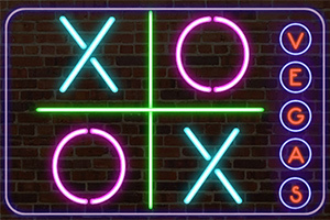 Biểu tượng neon chữ X và O cùng với chữ VEGAS trên nền gạch