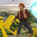 Người đàn ông đội mũ cao bồi đứng giữa các khối màu vàng với hình khối màu xanh lơ lơ lửng trong không trung