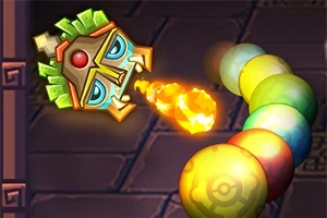 Một đầu tượng mặt nạ phun ra quả cầu lửa về phía chuỗi bóng nhiều màu sắc