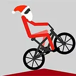 Người mặc đồ ông già Noel đang lái xe đạp trên mặt đất màu đỏ